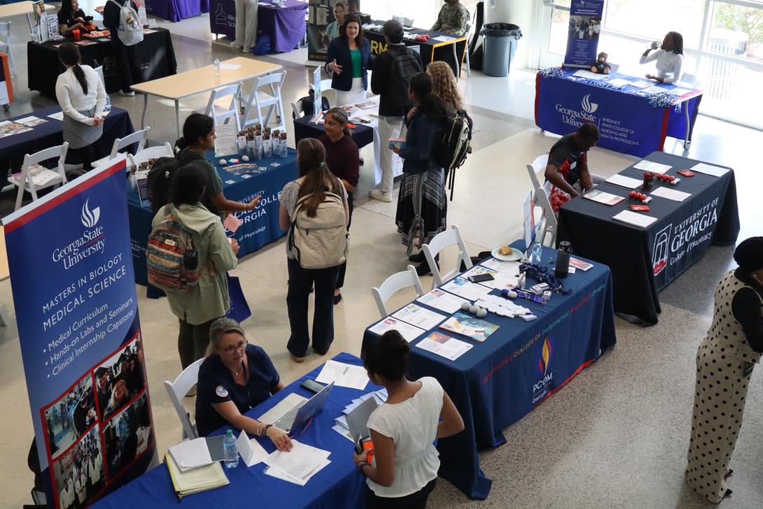 Student networking at the health professional school fair.