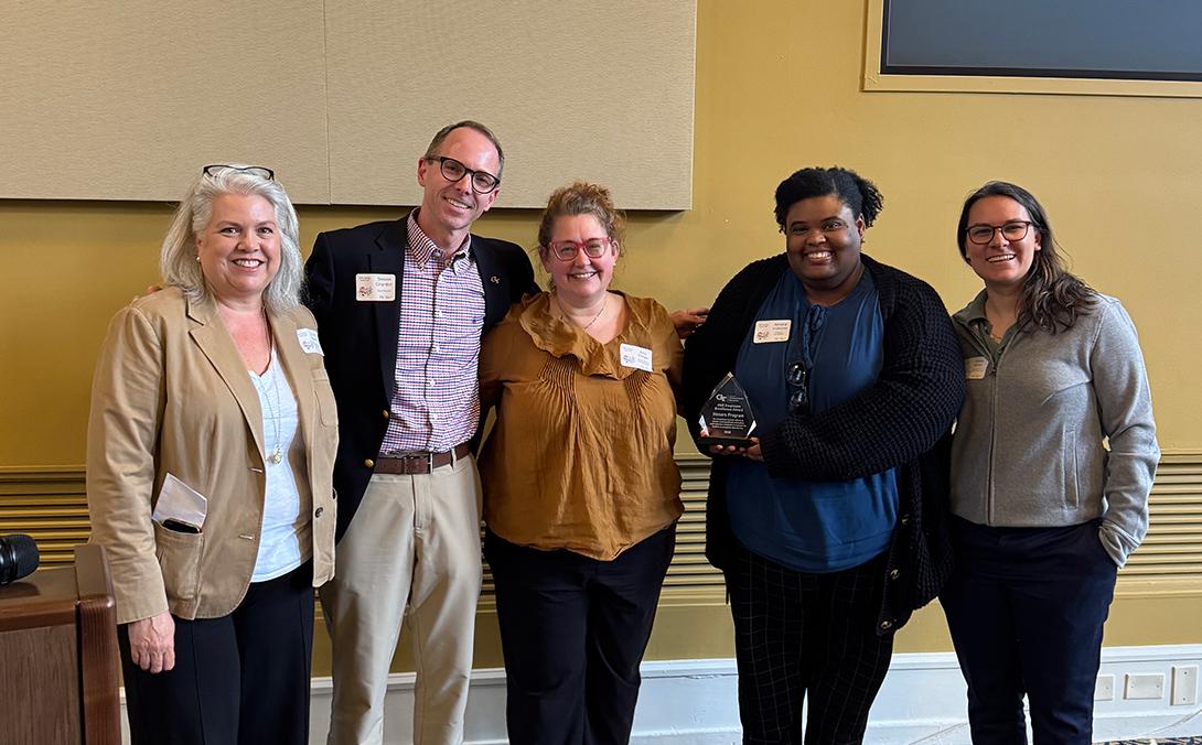 Honors Program team members pose for a photo with Vice Provost Steven Girardot and EECC Chair Kristi Hesse.